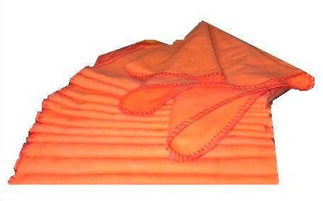 a stack of orange shoe shine cloths