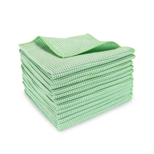 a stack of green waffle weave towels